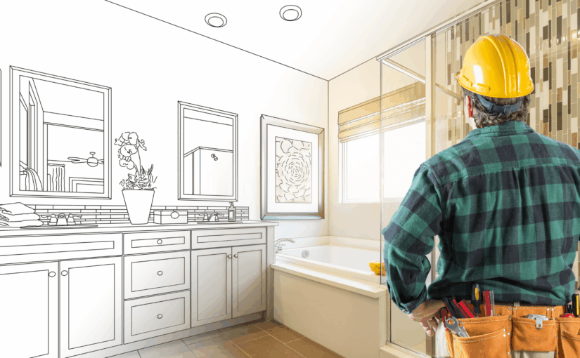 Construction worker in hard hat and tool belt viewing bathroom renovation blueprint overlay on completed space with vanity, mirrors, and bathtub