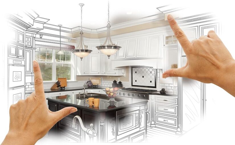 Hands framing a custom kitchen design showing sketch and rendered photo of white cabinetry, black island countertop, stainless steel appliances, pendant lighting, and subway tile backsplash